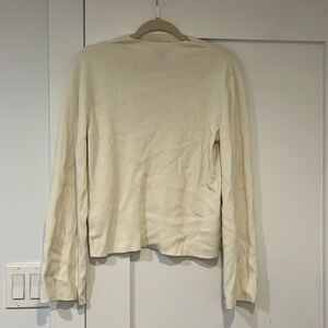 Cream ribbed mock neck sweater with bell sleeves